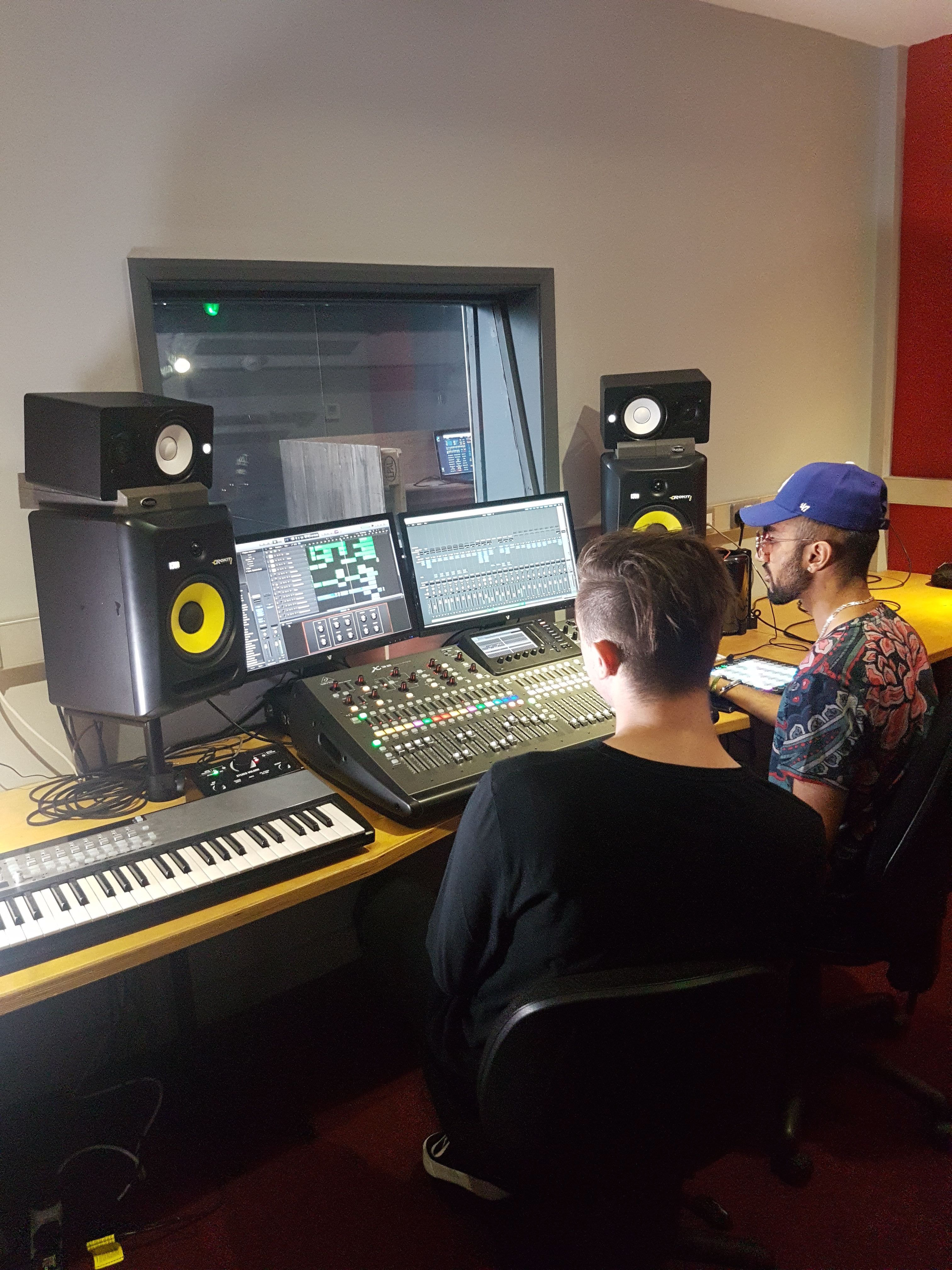 Image of two young men in a recording studio